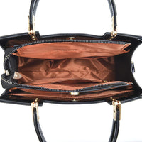 Top view of black handbag with brown interior, multiple zippered compartments and gold hardware