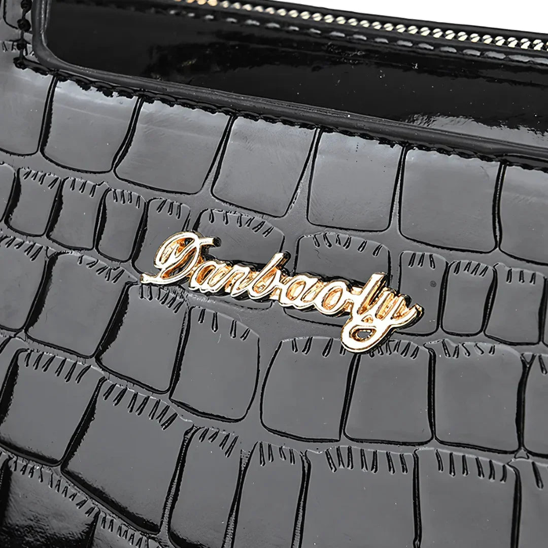 Black crocodile embossed handbag with gold Danbaoly logo and zipper