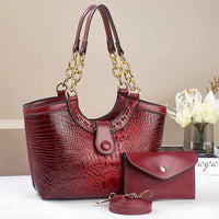 Red crocodile pattern handbag set with gold chain handles and matching wallet