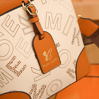 Cream and brown MILAXITILANGXI handbag with gold logo tag and letter pattern design