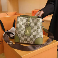 Green patterned MILANTIANSI handbag with brown strap on orange gift box