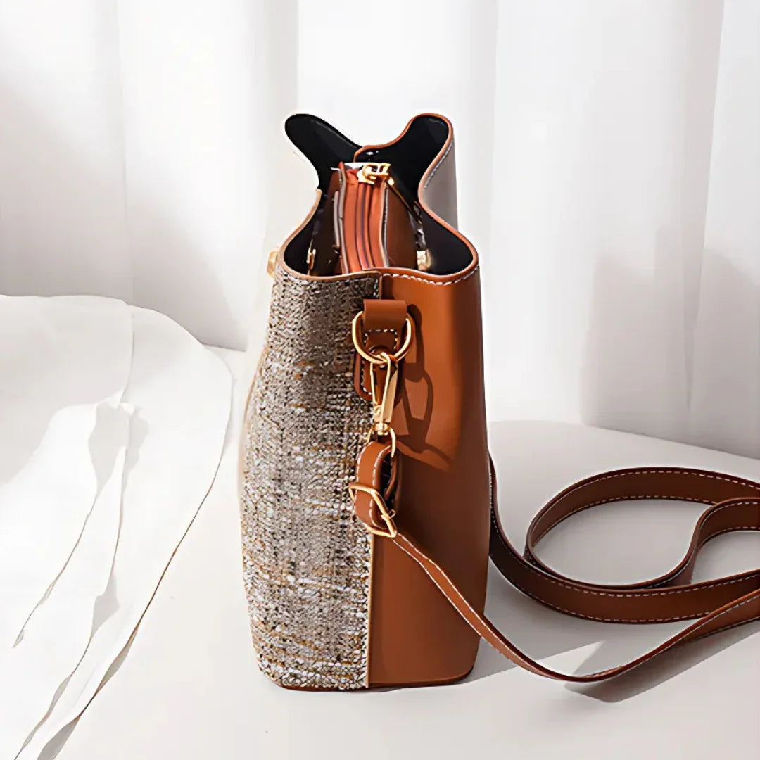 Brown leather and tweed shoulder bag with gold hardware on a white background