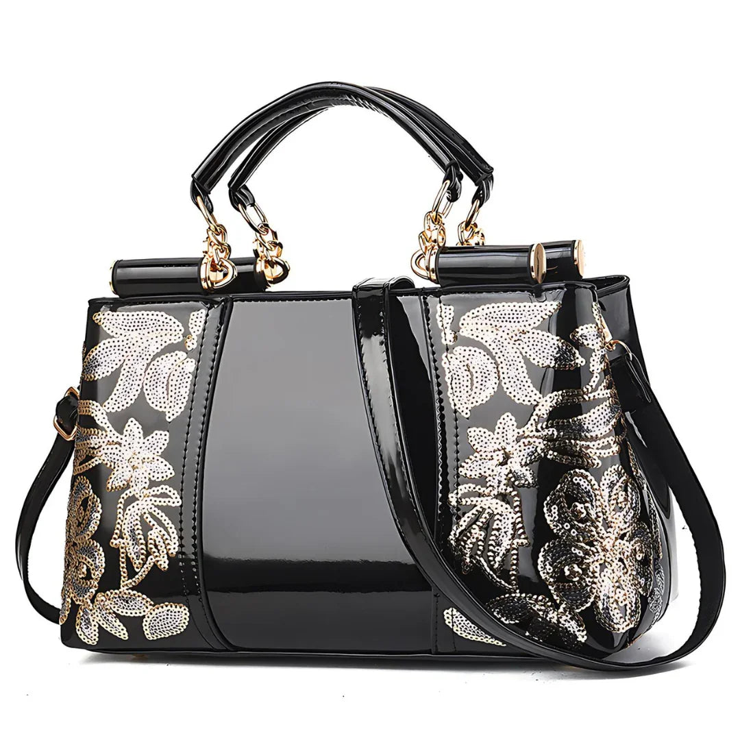 Glossy black handbag with gold floral sequin embroidery and dual handles