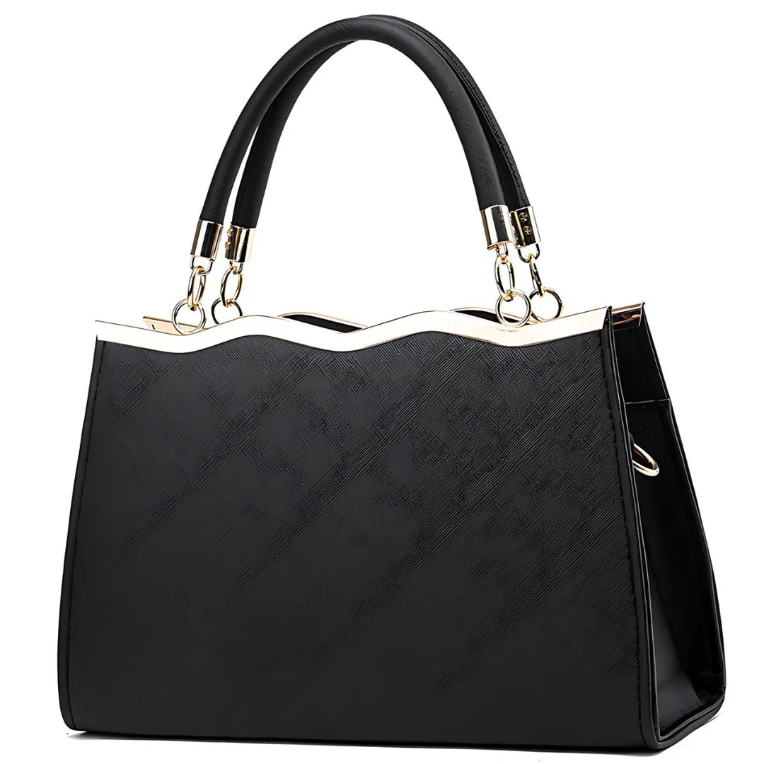Elegant black handbag with gold trim and dual handles on a white background