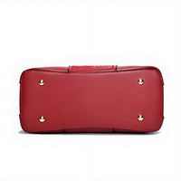 Red leather handbag bottom with gold metal feet on white background