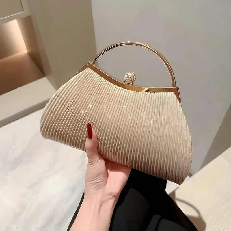 Elegant beige pleated evening clutch purse with gold handle and crystal clasp