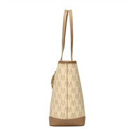 Beige monogram tote bag with brown leather trim and long handles side view