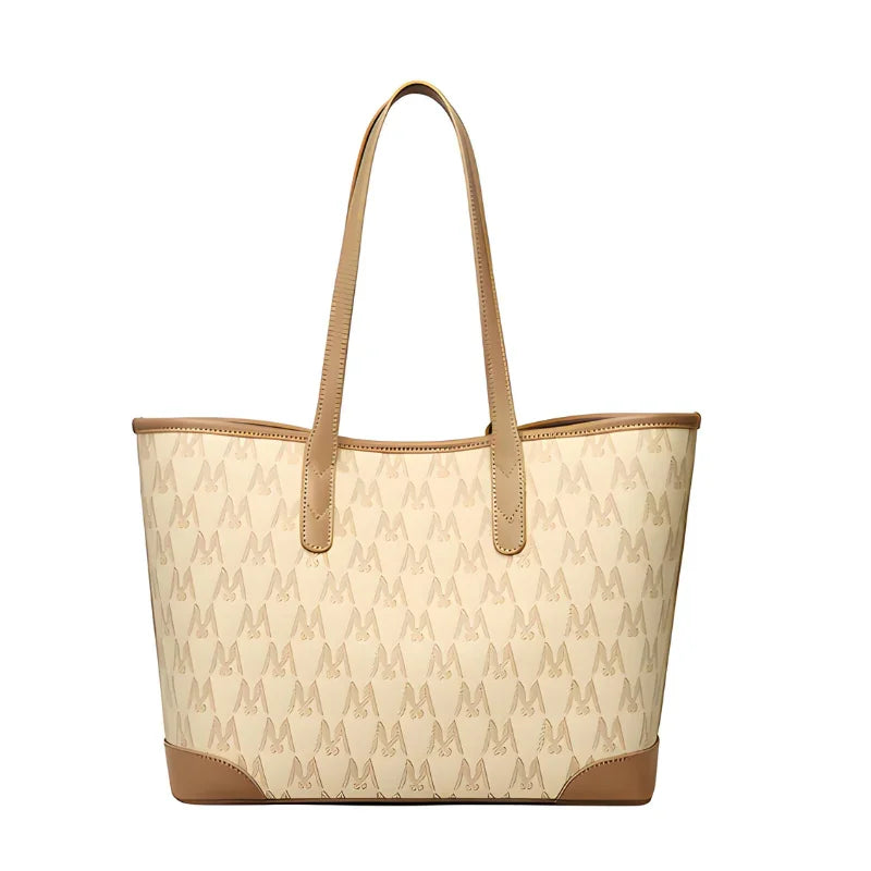 Beige tote bag with dog pattern and brown leather trim, stylish shoulder handbag
