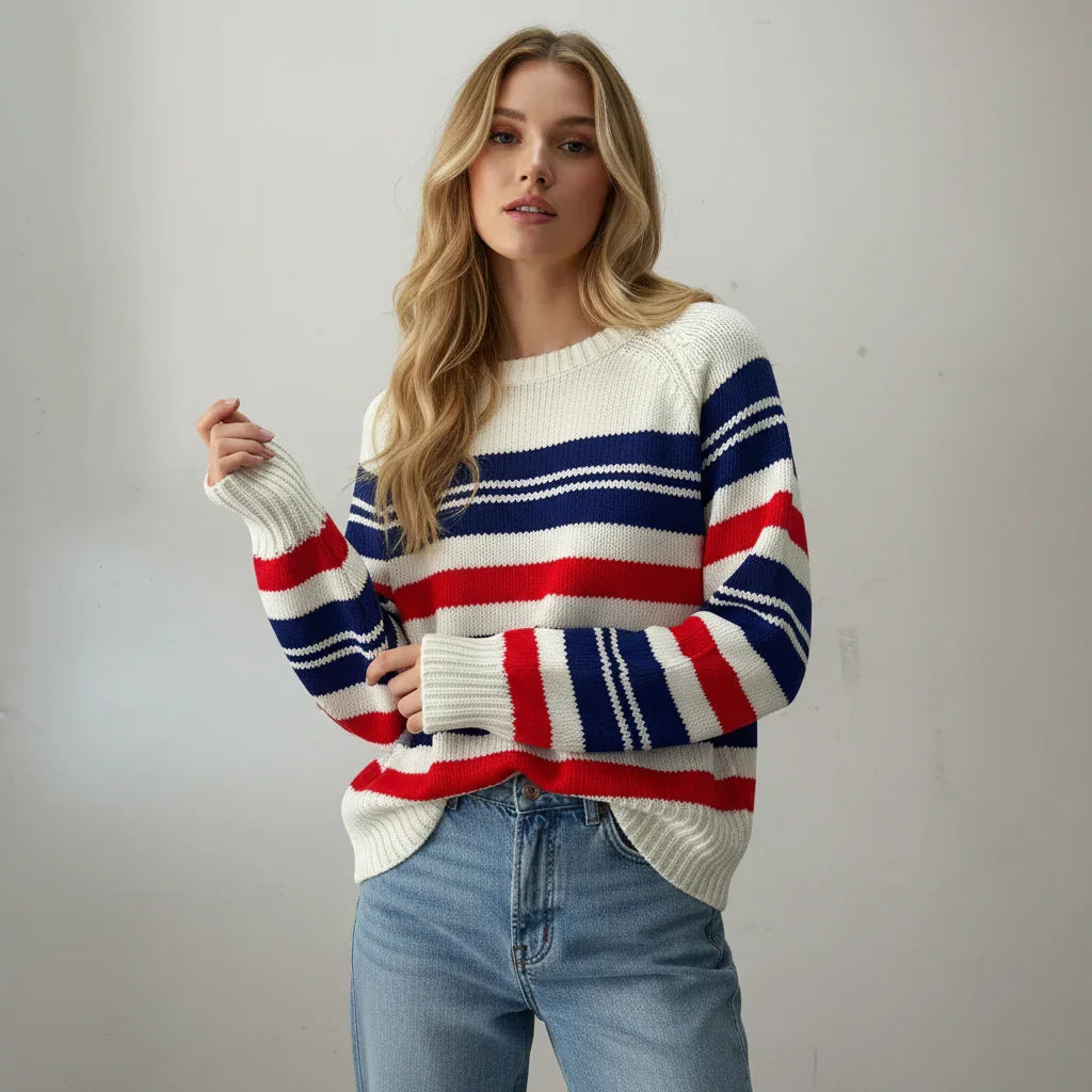 Woman wearing a striped Vintage sweater with a neutral background