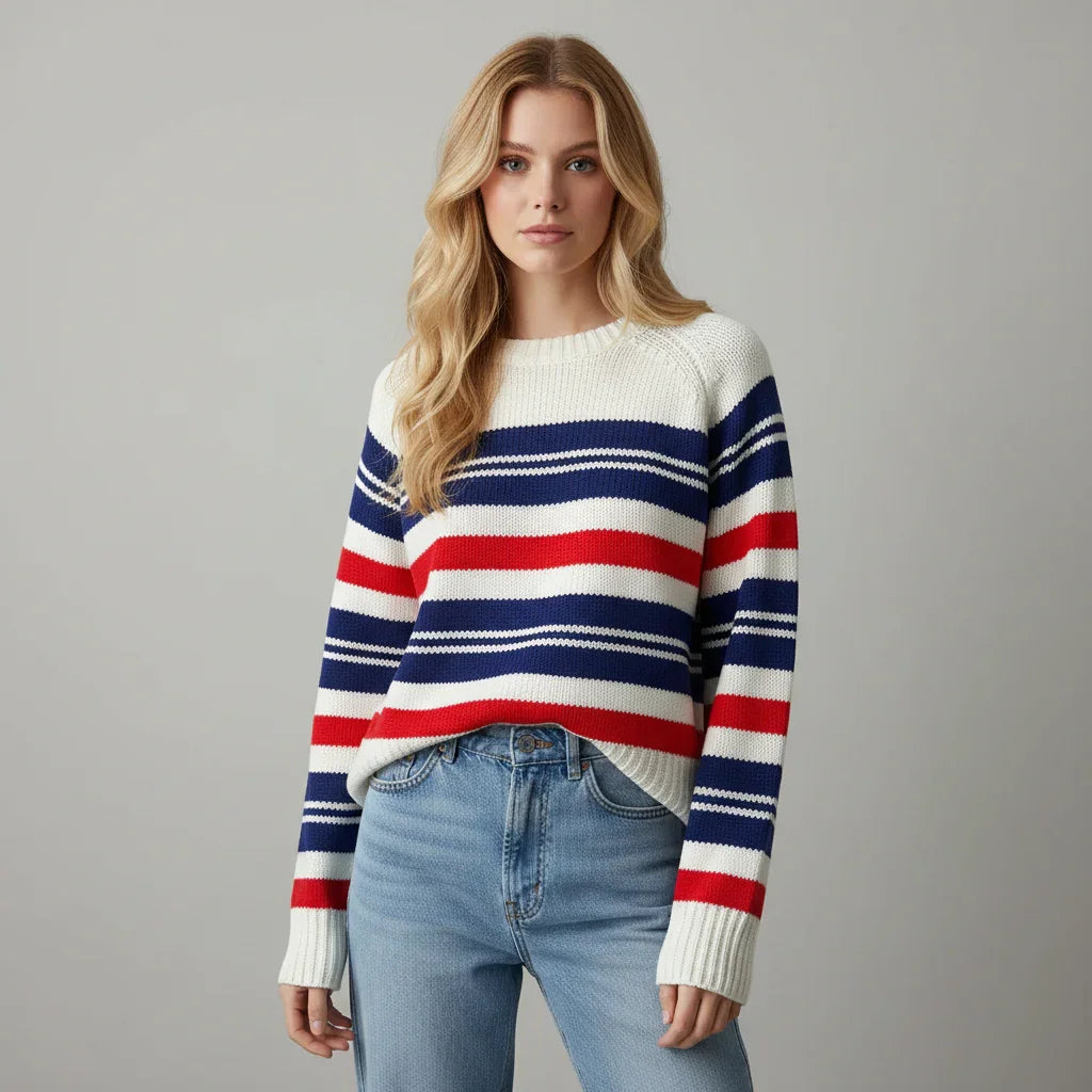 Woman wearing a striped Vintage sweater with a neutral background