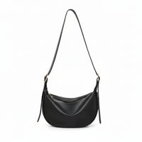 Black leather crescent shoulder bag with zipper, minimalist design on white background