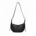 Black leather crescent shoulder bag with zipper, minimalist design on white background