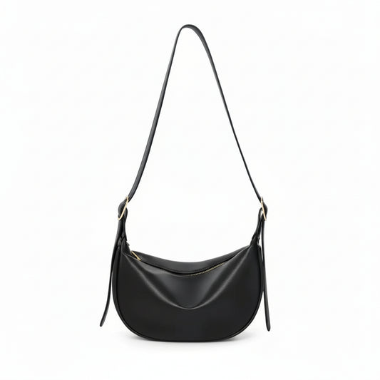 Black leather crescent shoulder bag with zipper, minimalist design on white background