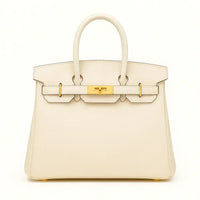Women's genuine leather tote bag in cream with gold hardware on a white background