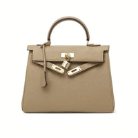 Beige women's genuine leather tote bag with gold hardware and top handle on white background