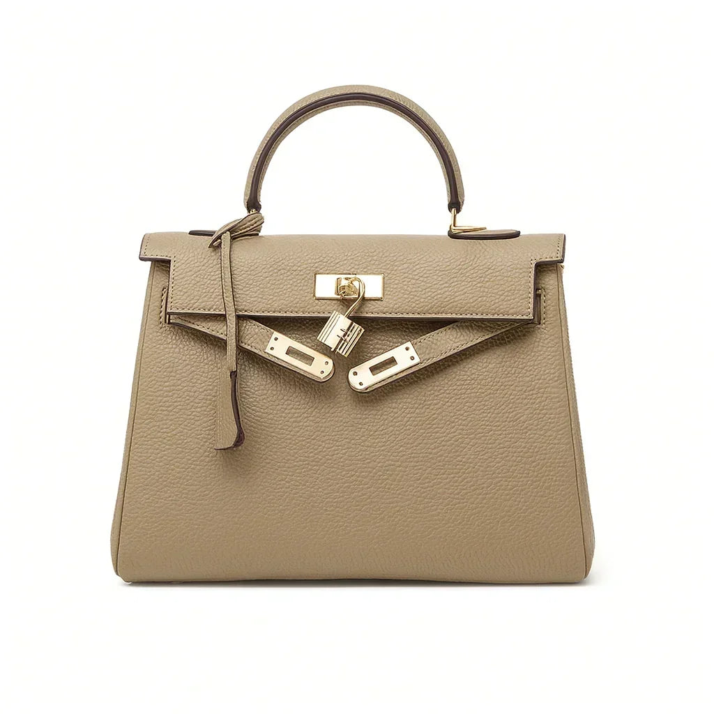 Beige women's genuine leather tote bag with gold hardware and top handle on white background