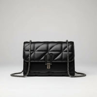 Black quilted leather crossbody bag with chain strap on white background