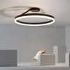 Black Round Minimalist LED Ceiling Light for Indoor Spaces - Rebooters