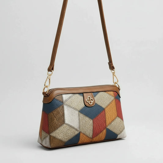 Colorful geometric patchwork leather crossbody bag with gold hardware on a white background