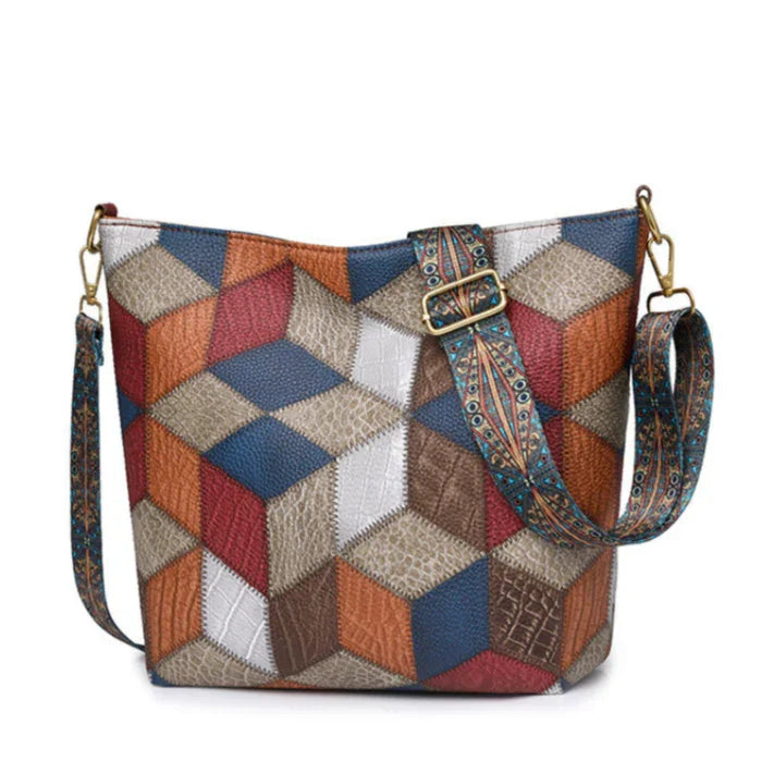 Geometric patchwork leather crossbody bag with adjustable patterned strap
