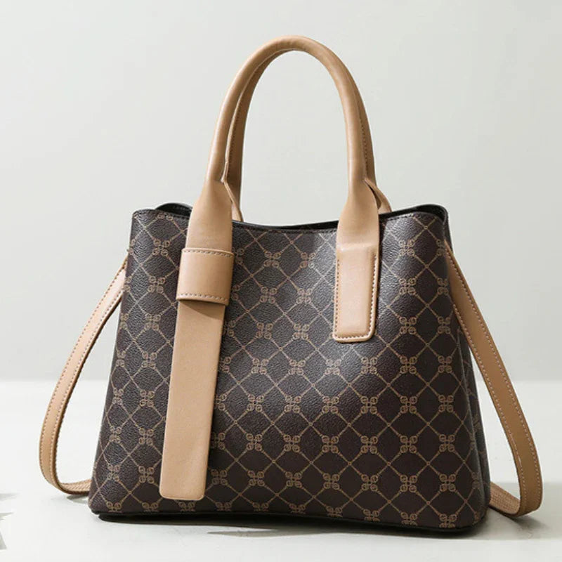 Brown designer handbag with tan handles and geometric pattern, luxury fashion purse