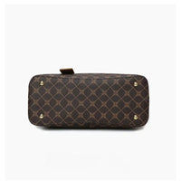 Bottom view of brown patterned leather handbag with gold feet on white background