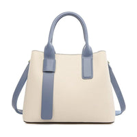 Beige and blue leather handbag with top handles and shoulder strap on white background